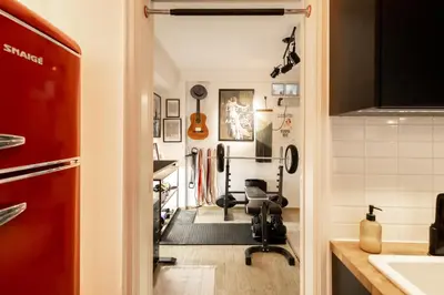 a home gym with a chair in a room at The loft in Athens