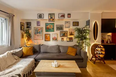a living room with a couch and a table at The loft in Athens