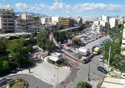 a city with cars parked in a parking lot at Modern Comfort Minutes from Plaka & Monastiraki in Athens