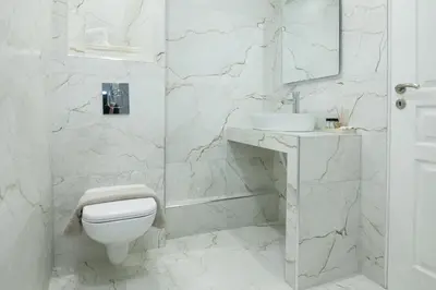 a white bathroom with a toilet and a sink at Athens Luxury center Aparts F&G in Athens