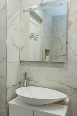a bathroom with a white sink and a mirror at Athens Luxury center Aparts F&G in Athens