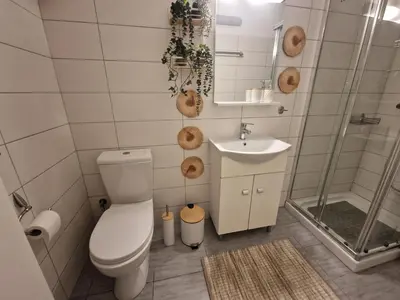 a bathroom with a toilet and a sink and a shower at AIOLOU st - 2 BDR APT - NetFlix in Athens