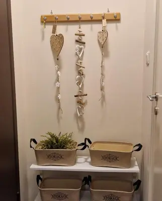 a shelf with hearts on a wall with pots and pans at AIOLOU st - 2 BDR APT - NetFlix in Athens