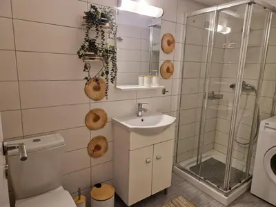 a bathroom with a toilet and a sink and a shower at AIOLOU st - 2 BDR APT - NetFlix in Athens