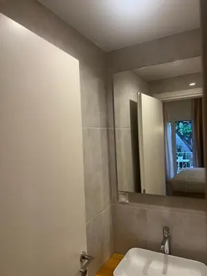 a bathroom with a sink and a mirror at Athens Ilisiam in Athens