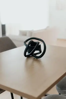 a black object sitting on top of a table at Beach Bliss Studio in Athens