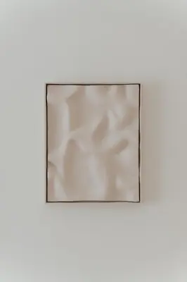 a mirror on a white wall with a white background at Beach Bliss Studio in Athens