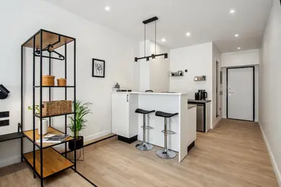 a kitchen with a counter and stools in a room at Stylish Escape Suite in Athens in Athens