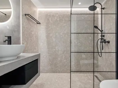 a bathroom with a shower and a sink at Exquisite Athens Center Suite in Athens
