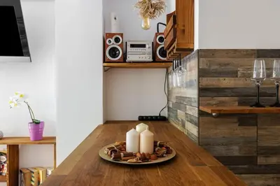a plate of food on a table with two candles at Dreamy Cove, Artistic Hideaway near Floisvos 1BD in Athens