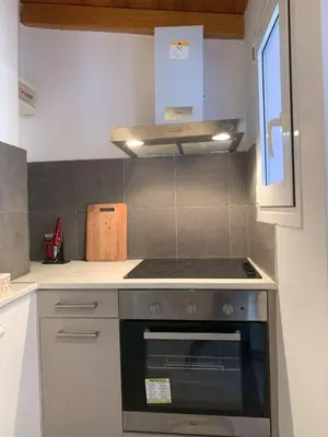 a kitchen with a stove top oven in a kitchen at Athens Central Hideout next to Acropolis in Athens