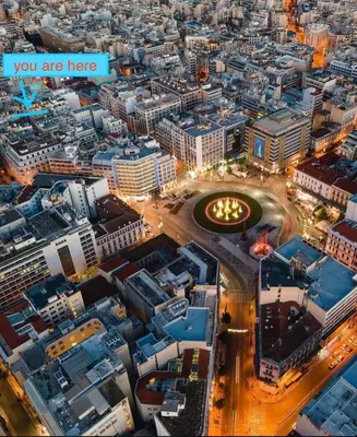 an overhead view of a city at night at Athens Central Stay, 3BD Apartment, 3min Metro in Athens