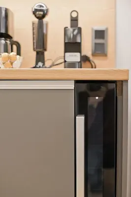 a microwave under a counter with a wooden top at Stylish Ilisia Stay Luxury Fully Reno 2BR, 2BA Apt in Athens