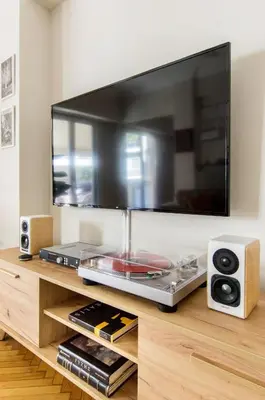 a flat screen tv sitting on top of a table at Modern Home W Balcony Near Kolonaki in Athens