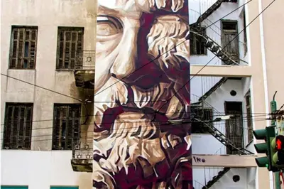 a painting of a face on the side of a building at Modern Home W Balcony Near Kolonaki in Athens