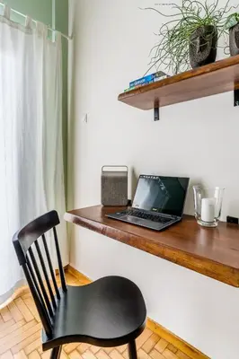 a desk with a laptop and a chair on it at Quiet 1br Home Near Plaka & Acropolis in Athens
