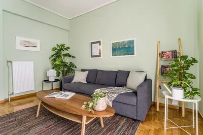 a living room with a couch and a table at Quiet 1br Home Near Plaka & Acropolis in Athens