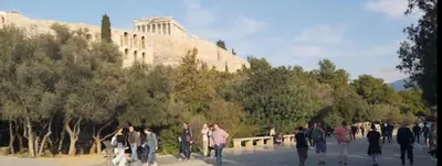 a group of people walking down a street at Spacious 3br Home Near Acropolis Museum in Athens