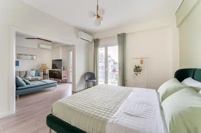 a bedroom with a bed and a living room at Spacious 3br Home Near Acropolis Museum in Athens