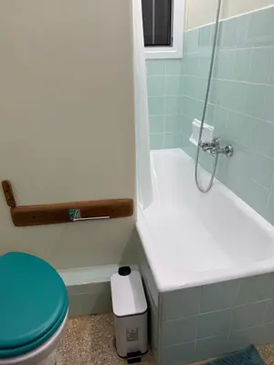 a bathroom with a toilet and a glass shower at Cozy place at the center of Athens in Athens