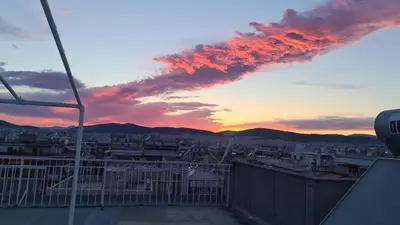 a view of a sunset from a rooftop at Athens city view loft on a budget in Athens
