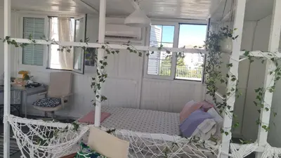 a room with a bed with ivy on it at Athens city view loft on a budget in Athens