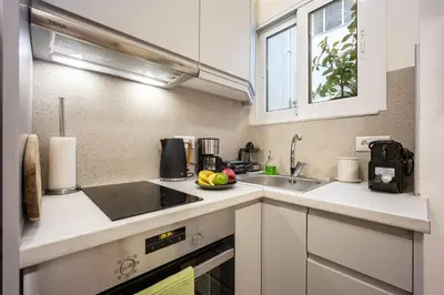 a kitchen with a sink and a counter top at DownTown Vibe #3 in Athens