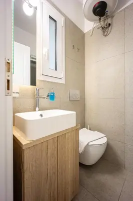 a bathroom with a sink and a toilet at DownTown Vibe #3 in Athens