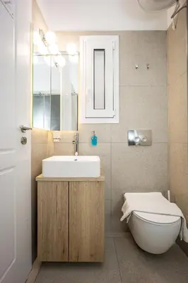 a bathroom with a sink and a toilet at DownTown Vibe #3 in Athens