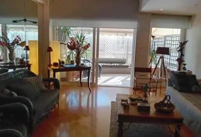 a living room with a couch and a coffee table at Kolonaki Art Suite in Athens
