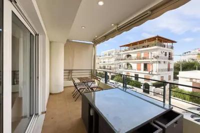 an apartment balcony with a view of a building at Spacious Family Apt in Glyfada in Athens