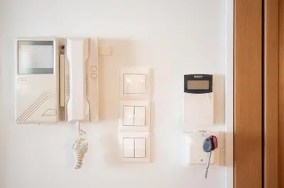 a wall with various items on a wall at Spacious Family Apt in Glyfada in Athens