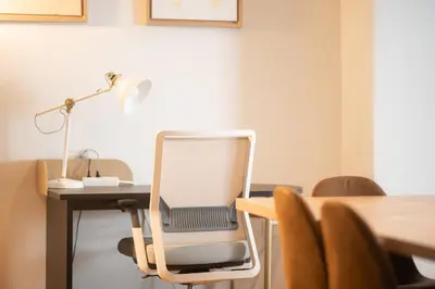 an office with a desk with a chair with a laptop on it at Spacious Family Apt in Glyfada in Athens