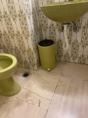 a bathroom with a sink and a toilet at Spyros apartment 2 in Athens