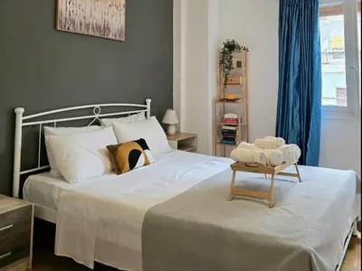 a bedroom with a bed with a table on it at Apollonas in Athens