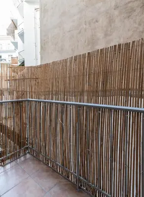 a room with a wooden fence on the wall at Erechthiou 15 Koukaki Apartment by Athens Concept Residences in Athens