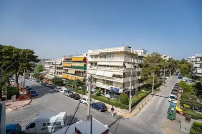 an overhead view of a city street with cars and buildings at Oikia in Athens