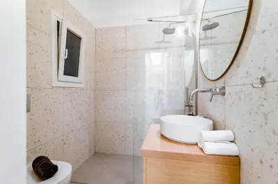 a bathroom with a sink and a mirror at Psirri Urban Chic in Athens