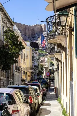 a street with cars parked on the side of the road at The Parthenon Porch for Familys & Groups , 4BR ! in Athens