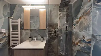 a bathroom with a sink and a shower at Nicolas Home in Athens