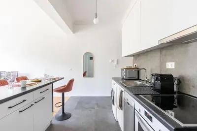 a kitchen with a counter and a chair in it at 2br Apt Near Ancient Stadium MK in Athens