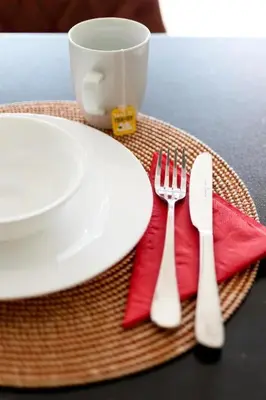 a table with a plate and a fork and knife at 2br Apt Near Ancient Stadium MK in Athens