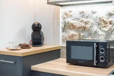 a microwave sitting on top of a counter at PetraLab By Greece Apartments in Athens