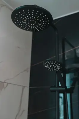 a black stool sitting next to a wall at Brand New Building Deluxe Apartments With Parking Nearby Train in Athens