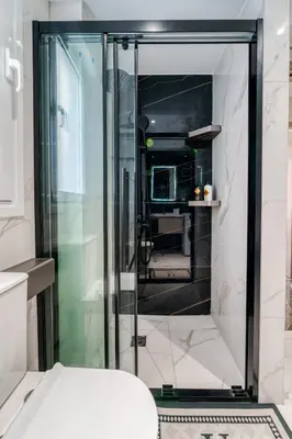a glass shower in a bathroom with a toilet at Brand New Building Deluxe Apartments With Parking Nearby Train in Athens