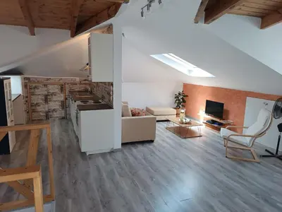 a large living room with a kitchen and a living room at ATH Airport, Loft in Painia in Paianía