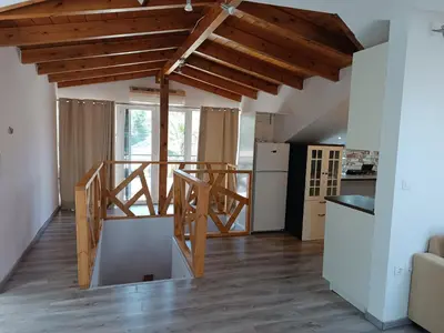 a kitchen with a staircase in a house at ATH Airport, Loft in Painia in Paianía