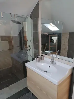 a bathroom with a white sink and a shower at ATH Airport, Loft in Painia in Paianía