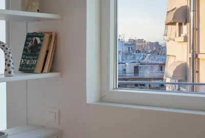 a window with a view of a city at Top Floor Stunning Acropolis View in Athens