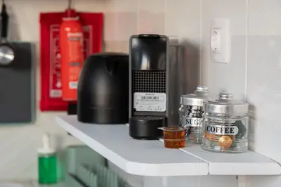 a counter with a coffee maker on a shelf at Top Floor Stunning Acropolis View in Athens